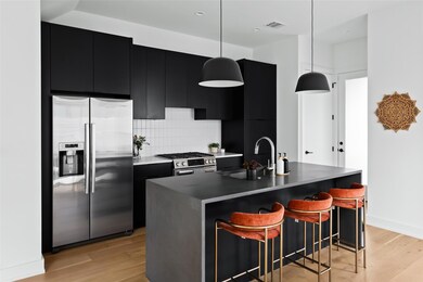 Kitchen with stainless steel appliances, dark cab