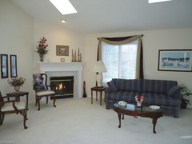 Th great room features a gas log fieplace with blo
