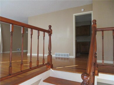 Looking up the stairs to the living room and through to the kitchen.