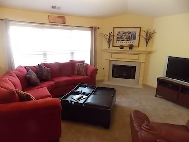 Spacious living room with fireplace. All furniture throughout the home is negotiable. What a great place to relax with your family/friends.