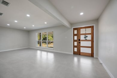 Entryway featuring recessed lighting and beamed ceiling
