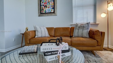 Living room with dark hardwood / wood-style floori