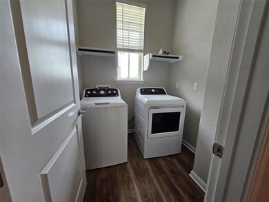 Washroom featuring independent washer and dryer a