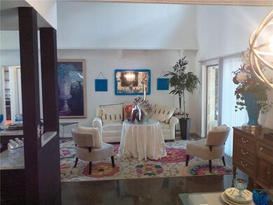 DESIGNER LIVING ROOM WITH SLIDER TO THE COVERED PA