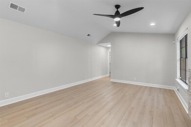 Empty room featuring recessed lighting, lofted ceiling, light wood-type flooring, and ceiling fan