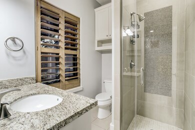 Immaculate full bath down with glass shower