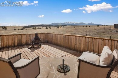 View of patio featuring a deck with mountain view 