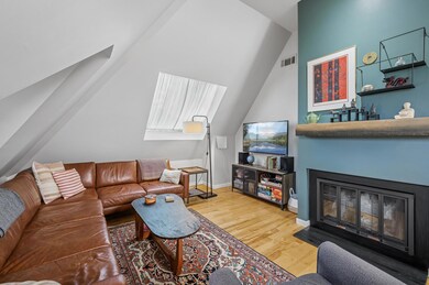 The Living Room Complete With A Wood Burning Fireplace And Brand New Skylight