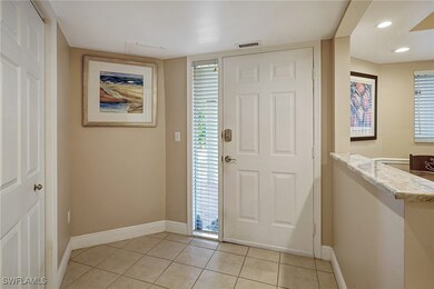 Entrance foyer featuring light tile patterned floo