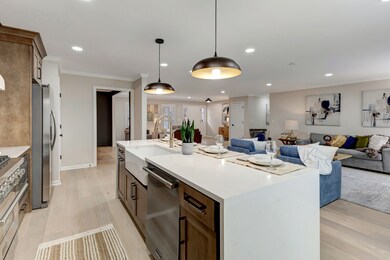 Spacious Kitchen with Waterfall Granite on the Island