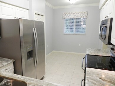 View of kitchen from counter. 
Breakfast nook
