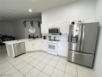Kitchen with stainless steel appliances, light til