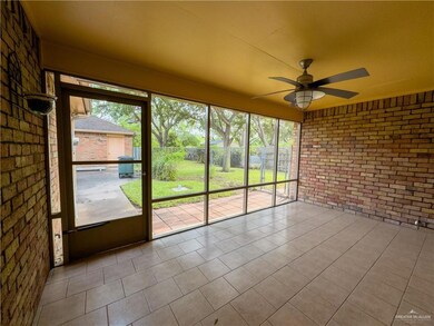 Unfurnished sunroom with a ceiling fan
