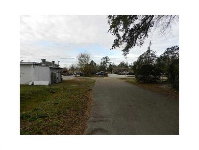 Land. The lot is Zone Commercial and sits behind C