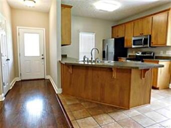 Hardwood floors and tile, view from living area to