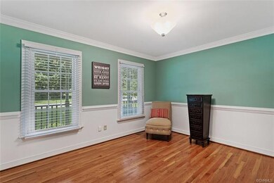 Formal Dining Room with hardwood floors, crown mol