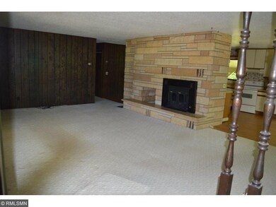 Large living room with stone fireplace. Really thr