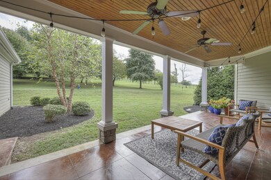 Overlook your peaceful backyard from the covered back porch.