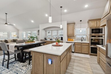 Spacious kitchen features quartz counter tops, upg
