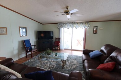 Large spacious living room with sliders to covered