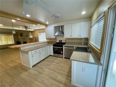 Kitchen featuring stainless steel appliances, wall