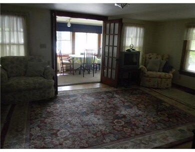 Living Room. Looking out to the porch