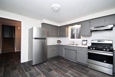 Updated kitchen in trending grey. New appliances a