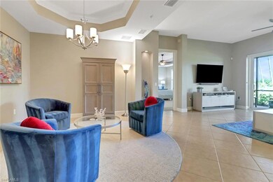 Living room featuring light tile patterned floors,