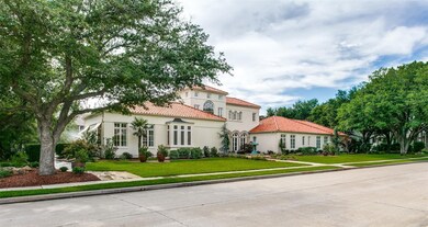 Mature trees, lush landscaping and a uniquely gorgeous home.