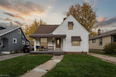 Bungalow-style home with a porch and a yard