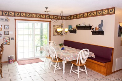 Wonderful bench seat and sliding glass doors to th