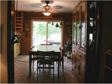 The dining features tile flooring and large slider