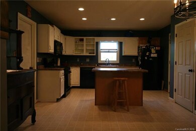 country kitchen; garage to left; basement door to 