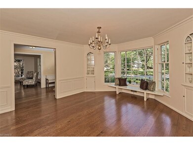 The dining room features a bay window and built-in