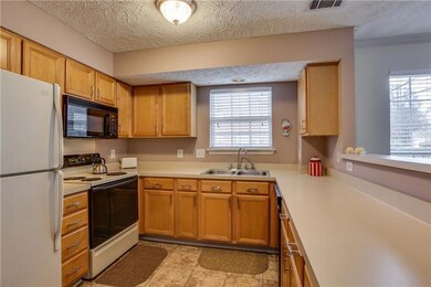Ceramic tile in kitchen. More storage in the pantry. Eat at kitchen bar.