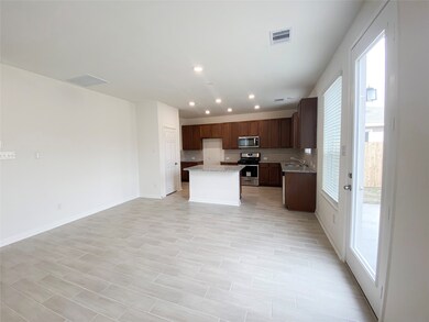 Open concept floor plan, kitchen opens to family r