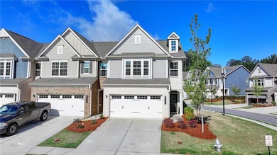 Townhome / multi-family property with a shingled r