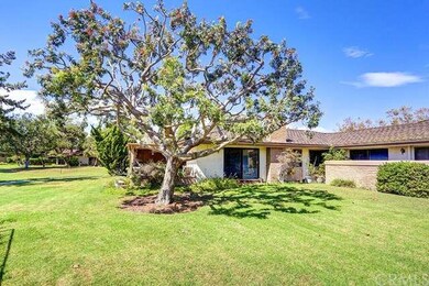 beautiful trees and shrubs surround the home.