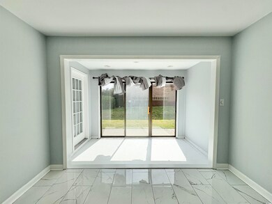 Interior space with marble finish floor and basebo