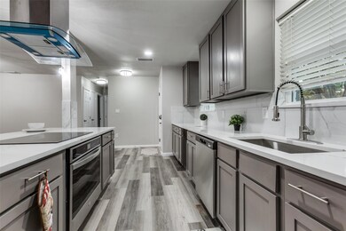 Kitchen featuring appliances with stainless steel 