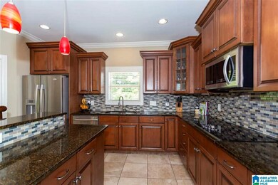 with Mahogany Stain Cabinets, Granite Tops, Stone 