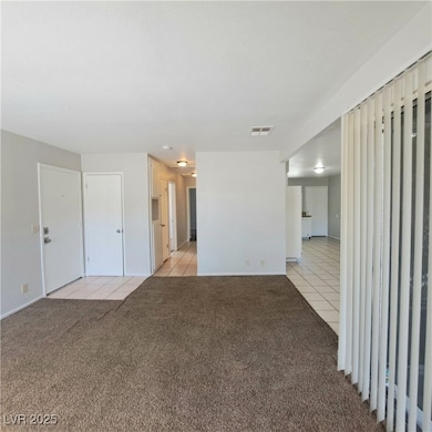 Unfurnished living room with light tile patterned