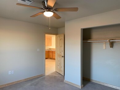 Unfurnished bedroom with baseboards, visible vents
