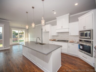 Kitchen with adjoining Breakfast Nook with light a