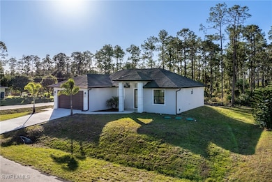 View of front of property with a front yard and a