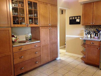 Kitchen. Tons of cabinet space & kitchen can easil