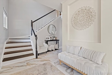 Step into a inviting foyer featuring new flooring