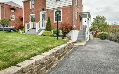 View of the decorative brick driveway retaining wa