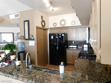 Kitchen view of freshly painted cabinets and brand