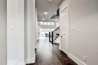 View from the front door though the living room to the back yard.